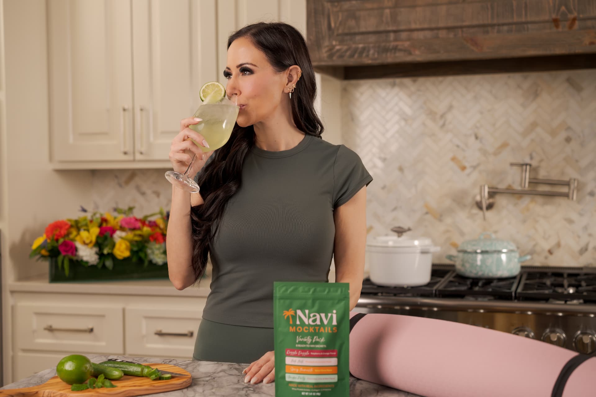 Emily sipping a garnished Navi mocktail