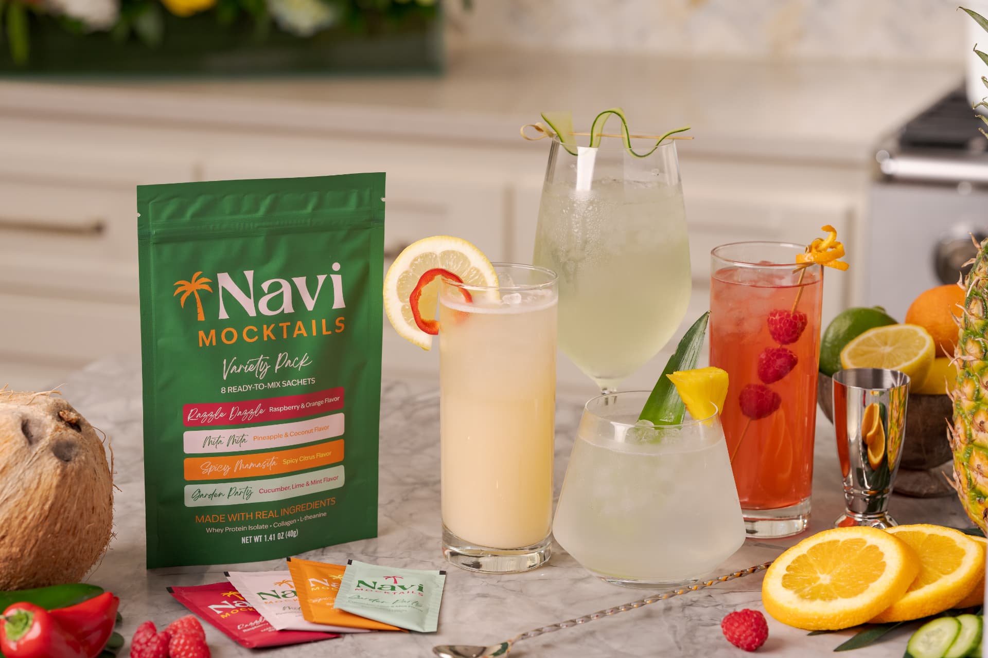 Navi Mocktails variety pack beside four freshly mixed mocktails on a marble counter